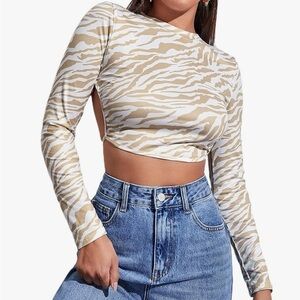 Beige and white open back long sleeved top